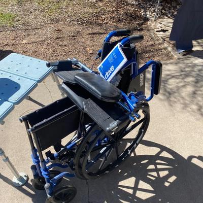 NEW WHEELCHAIR AND A SHOWER SEAT