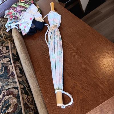 LADIES APRONS AND AN UMBRELLA