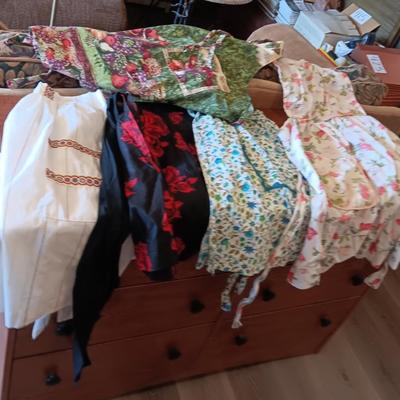 LADIES APRONS AND AN UMBRELLA