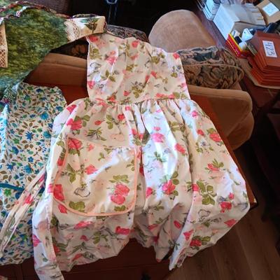 LADIES APRONS AND AN UMBRELLA