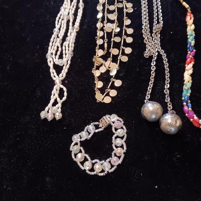 5 COSTUME NECKLACES AND 1 BRACELET