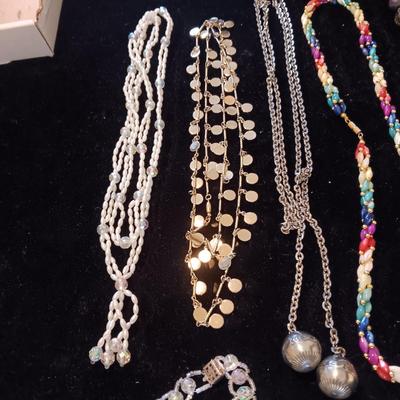 5 COSTUME NECKLACES AND 1 BRACELET