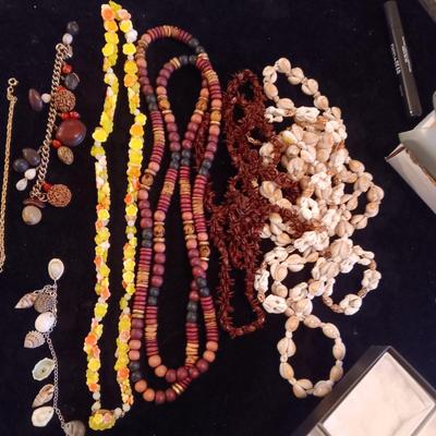 A VARIETY OF NECKLACES AND BRACELETS