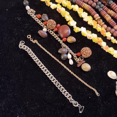 A VARIETY OF NECKLACES AND BRACELETS