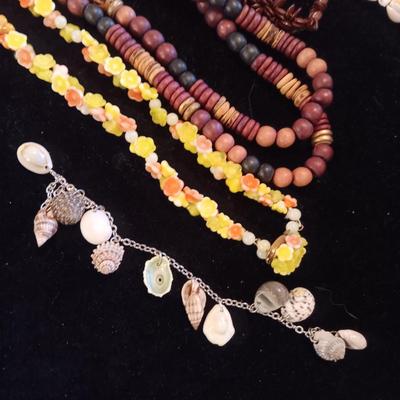 A VARIETY OF NECKLACES AND BRACELETS