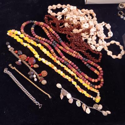 A VARIETY OF NECKLACES AND BRACELETS