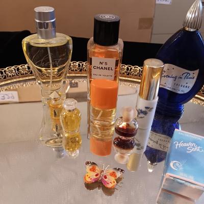 DRESSER MIRROR, VARIETY OF PERFUMES AND DRESS GLOVES