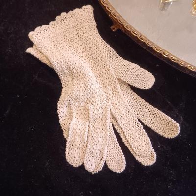 DRESSER MIRROR, VARIETY OF PERFUMES AND DRESS GLOVES