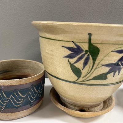 2 pottery planters with watering