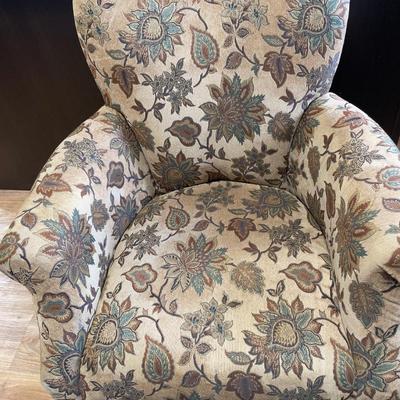 Tan accent chair with vines and leaf design