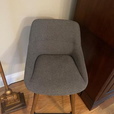 2 Beautiful Gray Padded Swivel Bar Stools. From Seat To Floor Measures Standard 23”. From Top To Floor Is 34” Excellent condition.