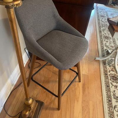 2 Beautiful Gray Padded Swivel Bar Stools. From Seat To Floor Measures Standard 23”. From Top To Floor Is 34” Excellent condition.