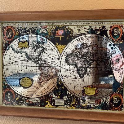 Antique world map on framed mirror