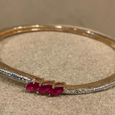 925 stamped gold tone bracelet with Ruby like stones