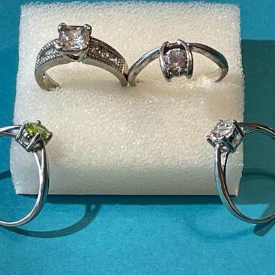 Lot of 4-Vintage Sterling Silver CZ Rings in VG Preowned Condition as Pictured.