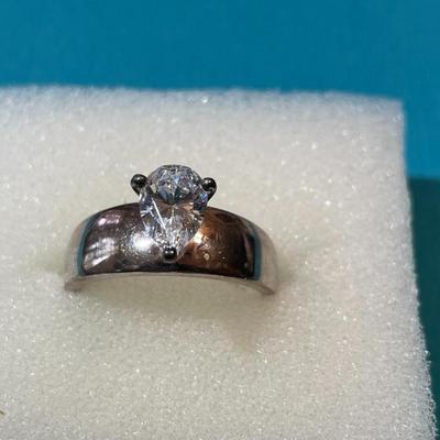Vintage Sterling Silver CZ Engagement Style Ring Size-8 w/Pear Shaped Center CZ Stone Measuring about .85-Carats in VG Preowned Condition.
