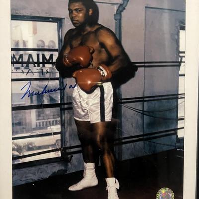 Muhammad Ali signed photo. GFA authenticated