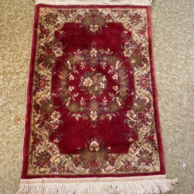 PERSIAN STYLE RUG AND A SMALLER STEP TRASH CAN