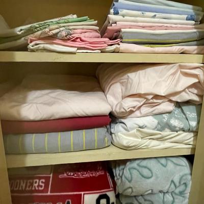 LINEN CLOSET FULL OF TOWELS, SHEETS AND BLANKETS