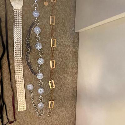 BELTS, BEADED COLLAR AND BARRETTES