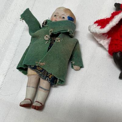 Lot of 4 small dolls