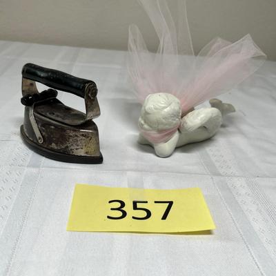 Child's sad iron & cupid