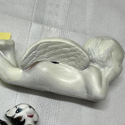 Child's sad iron & cupid