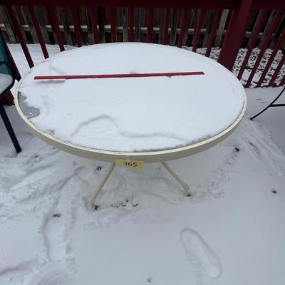 Round glass top patio table