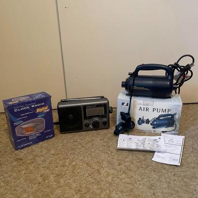 NEW CLOCK RADIO, PORTABLE AM/FM RADIO AND AN AIR PUMP