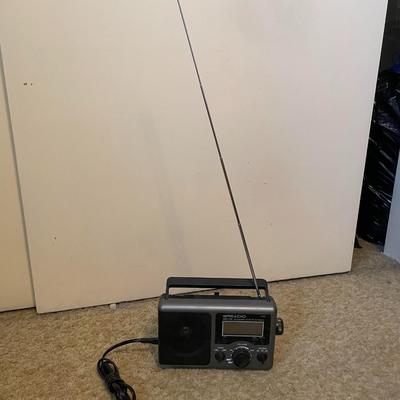 NEW CLOCK RADIO, PORTABLE AM/FM RADIO AND AN AIR PUMP