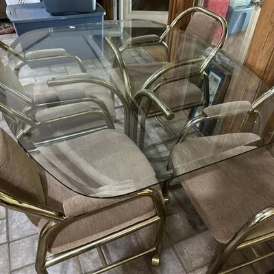 89 Glass Top Table with Four Rolling Chairs