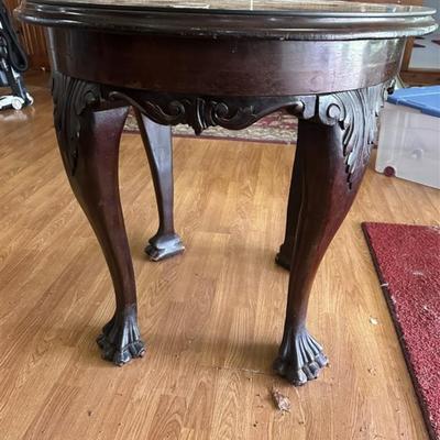 105 Antique Round Claw Foot Table (note see third photo-crack/split on curve)