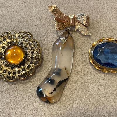 3 different stone brooches