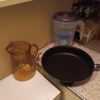 LARGE NORDIC WARE SKILLET, GLASS AND PLASTIC PITCHERS