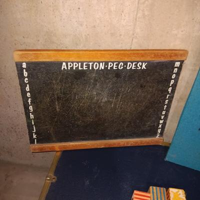 METAL TRUNK, CHALK BOARD, WOODEN BLOCKS AND YARN CLOWN ART