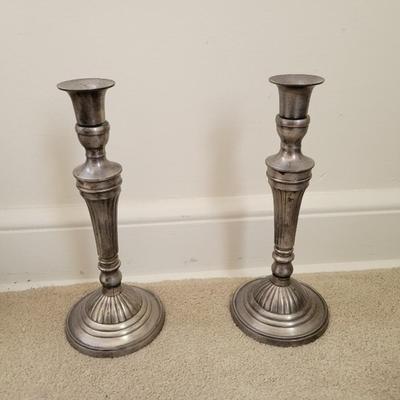 silver colored candle stick holder