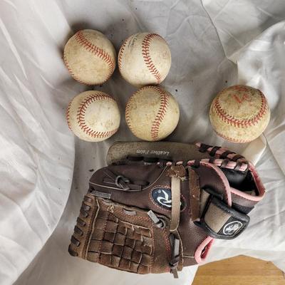 Youth girls baseball glove and balls.
