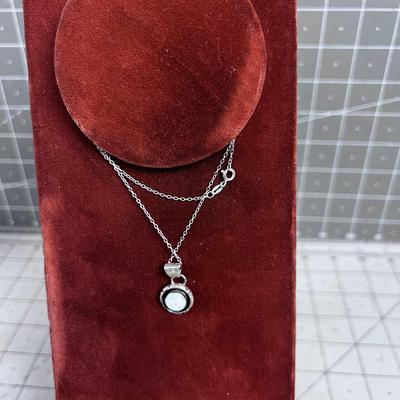 NEAT Looks like the MOON - Opal Pendant on Sterling Siler Chair