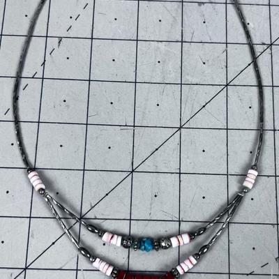 Liquid Silver with Red Jasper Stones plus other Beads. 