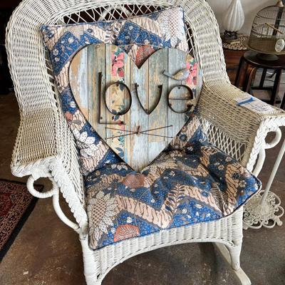 White Wicker Chair with Pillows and Love sign