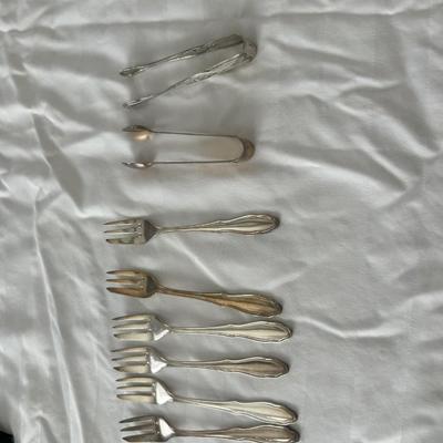 small silver forks and tongs