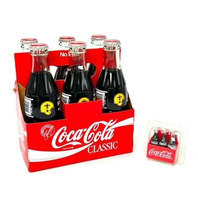 6 Pk Caddy of 8 Ounce, 1991 Saints NFC Western Division Champions Coca Cola Classic Bottles and 1 Miniature Magnet