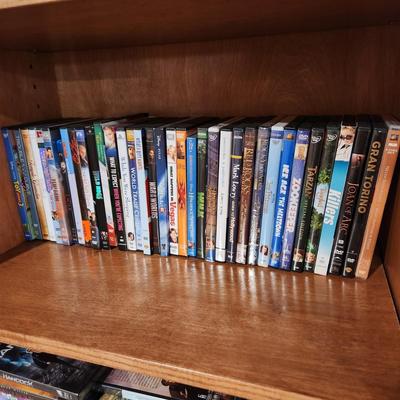 4 Shelves full of DVD's Some still sealed