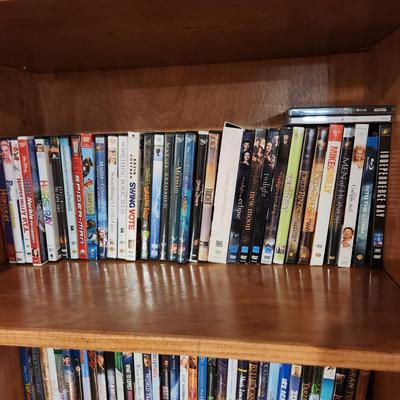 4 Shelves full of DVD's Some still sealed