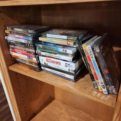 4 Shelves full of DVD's Some still sealed