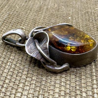 LOT 12 - Sterling Silver and Amber Pendant
