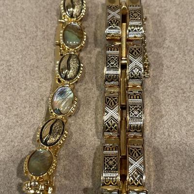 Cross bracelet and gold tone jewelry
