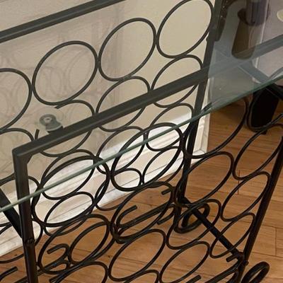 Wine Bar / table - wrought iron with tempered glass top. 26”H, 23”W, 11”D. Lots of spaces for wine.