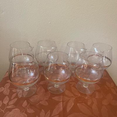 7 vintage large brandy snifters with gold trim and spouts.