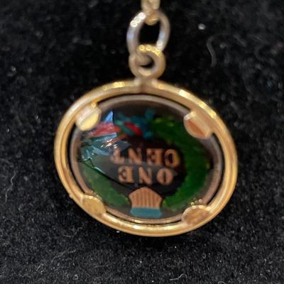 40â€ gold tone chain and One Cent necklace